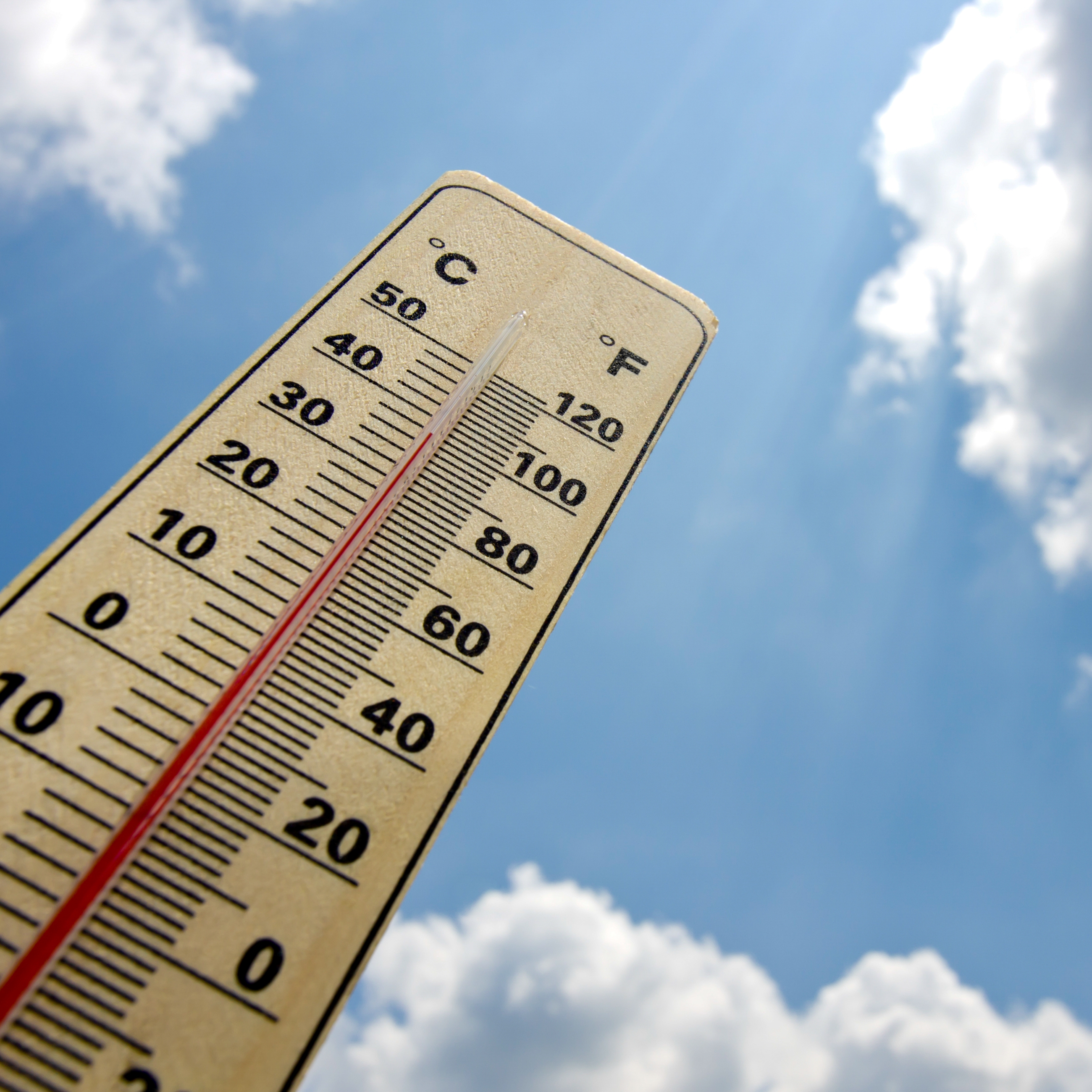 A thermometer showing a high temperature (100*F) where heat safety tips need to be taken into consideration 