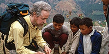 Tony meeting with boys helped by Save the Children near Likhu, Nepal.