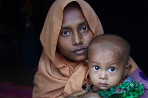 Majuma* fled her village in Northern Rakhine State with her husband and one and a half year old son after it was attacked. It took them five days to reach Bangladesh on foot, where they have found shelter in one of the makeshift settlements.