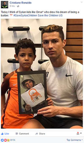 Cristiano Ronaldo with a child and his drawing.