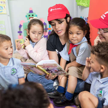 Singer-songwriter and Save the Children Ambassador Camila Cabello reads a book to the kids at a day care center in Puerto Rico. Photo Credit: Gabriel Gonzalez for Save the Children