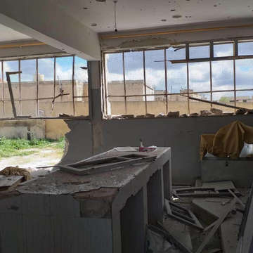 The walls, windows and interiors of a school building are destroyed following a shelling across Idlib, in North West Syria on April 22, 2019. The attack hit schools, infrastructure and displacement camps, driving thousands of people out of their homes. Photo credit: Global Media Unit/Save the Children, April 2019.
