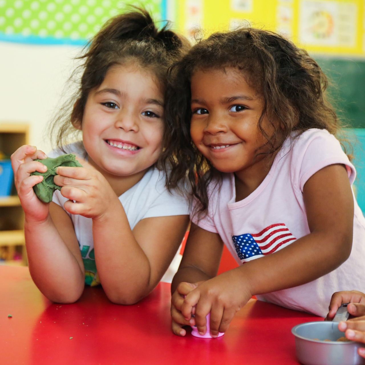 Dezirae, 4, and Harmony, 3, play with play-dough in their child care center in Texas. The center was heavily affected by Hurricane Harvey in August 2017, sustaining structural and interior damage and loss of critical classroom materials and equipment. In the aftermath of the catastrophic storm, funds, books and toys from Save the Children have helped restore and improve the child care center, and the children’s day-to-day experiences. Save the Children also replaced the center’s restroom and the counters in the kitchen. Photo by Ellery Lamm for Save the Children.