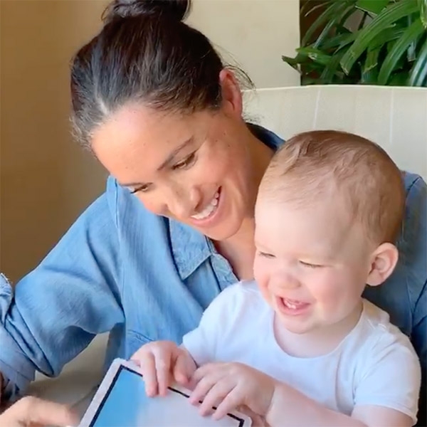 Duchess Meghan reads to baby Archie on his birthday.