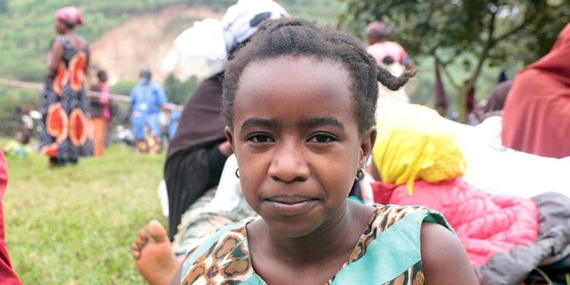An image of Alice, a child from DRC, staying in a refugee camp in Rwanda.