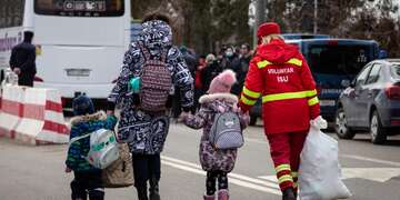 Ukraine refugees, including children, arriving in Romania receive humanitarian aid.