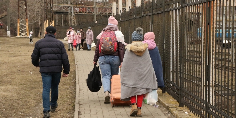 displaced family walking in the streets of Lviv, Ukraine