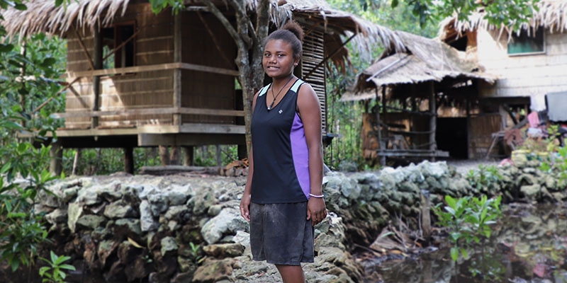 Jemma, 17, in her community in the Solomon Islands, which is being impacted by sea level rise.