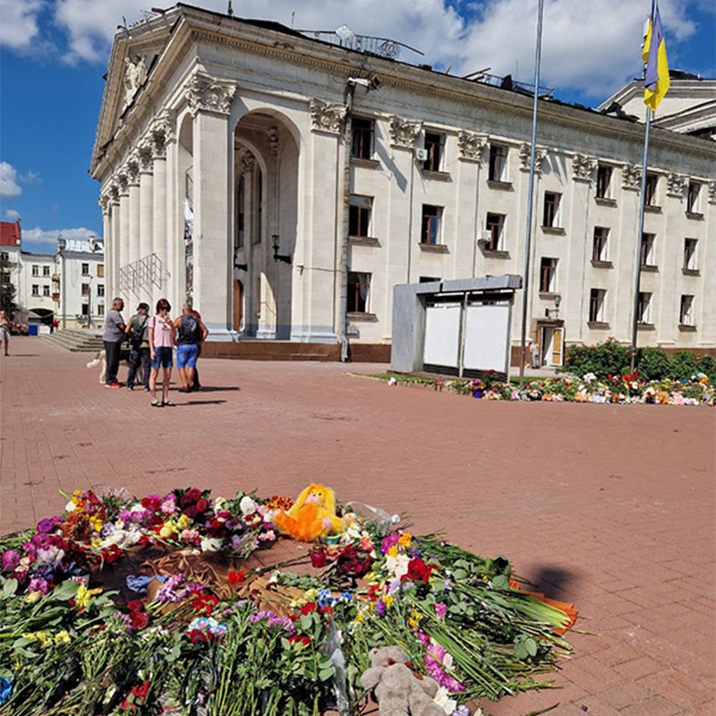 Toys and flowers lie in front of a theater in Chernihiv, Ukraine where a six-year-old girl was among the seven killed and about 180 injured after a missile strike in August 2023. 