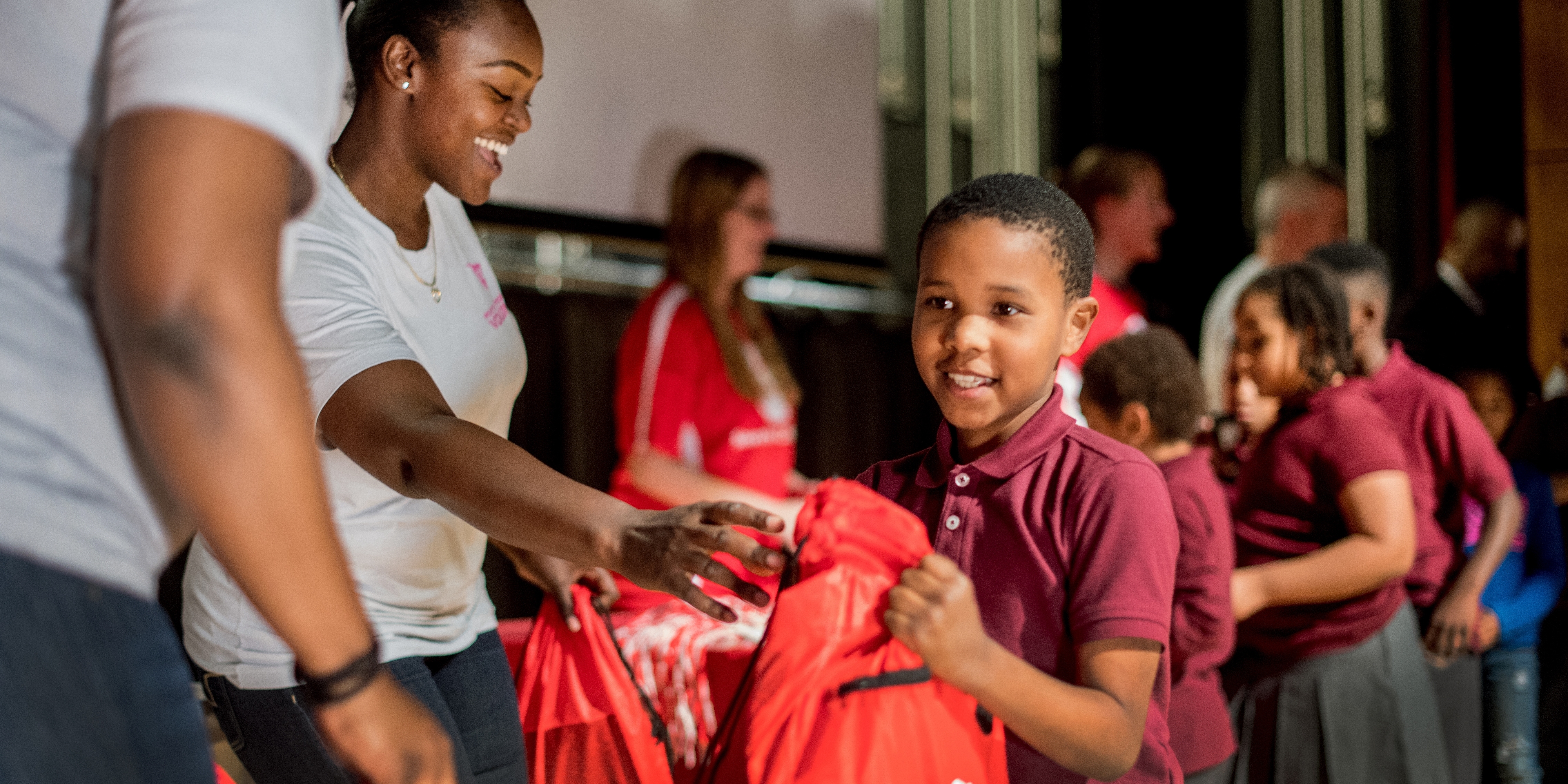 A boy receives a backpack at a prep rally to support Get Ready. Get Safe. Photo credit: Save the Children 2017.