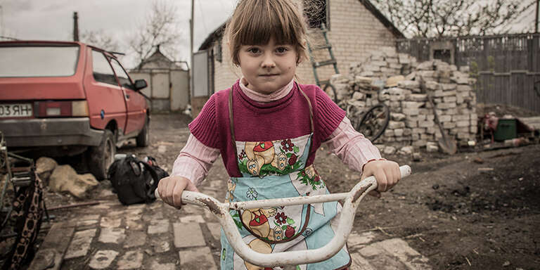Little girl on bike in Ukraine