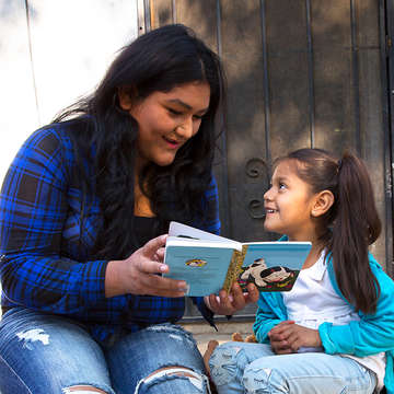 Rosa reads with her daughter, Surena, 4, during a home visit as part of Save the Children’s signature Early Steps to School Success program in Central Valley California. Photo credit: Tamar Levine / Save the Children 2017.