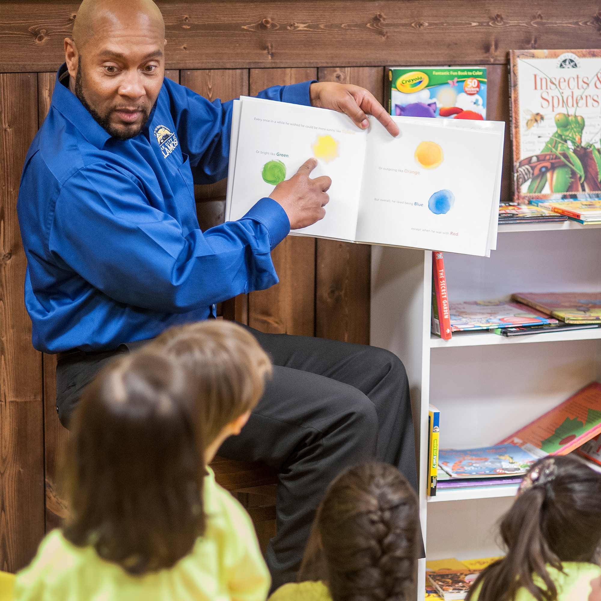 Toll House, a Local business unveils it's reading corner with a read-a- loud with Mayor Pro-Tem Tyron Coleman and students from the local pre-school. The reading corner is a new community initiative with local business, housing communities and doctors offices to foster everyday reading with children. Photo credit: Susan Warner / Save the Children 2016.