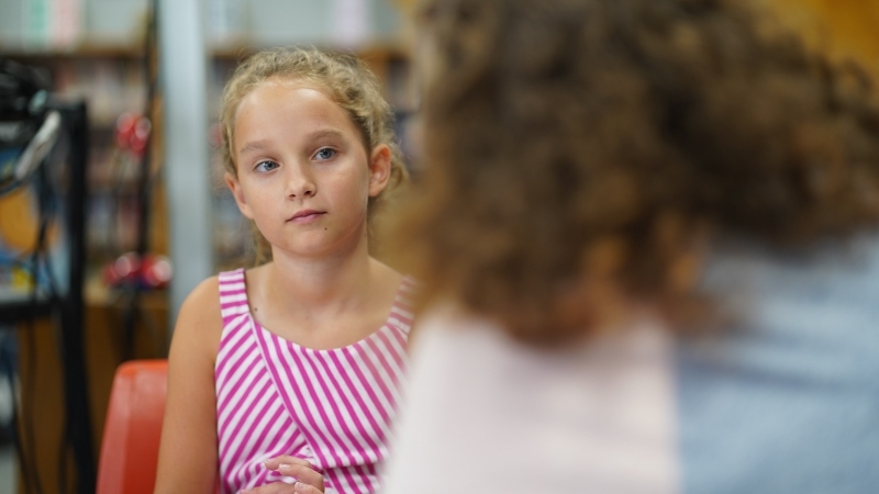 Elizabeth listens to her Save The Children Sponsorship Community Liaison in Kentucky