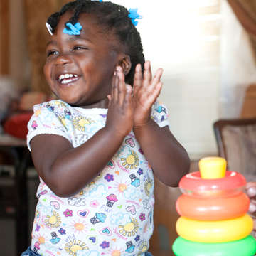 Meet Akeri, 1, whose sick mom is unable to care for her. Luckily, her dad, Denzel, never misses a home visit with Shenika, Save the Children's early childhood coordinator. Photo credit: Susan Warner / Save the Children 2015.