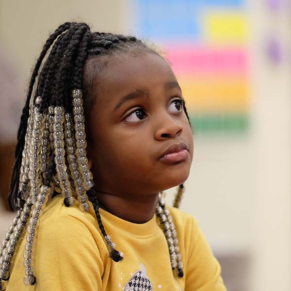 A 5-year old girl who is enrolled in Save the Children's Emergent Reader program at her school in Tennessee sits pensively in her classroom. Photo credit: Shawn Millsaps / Save the Children 2019. 