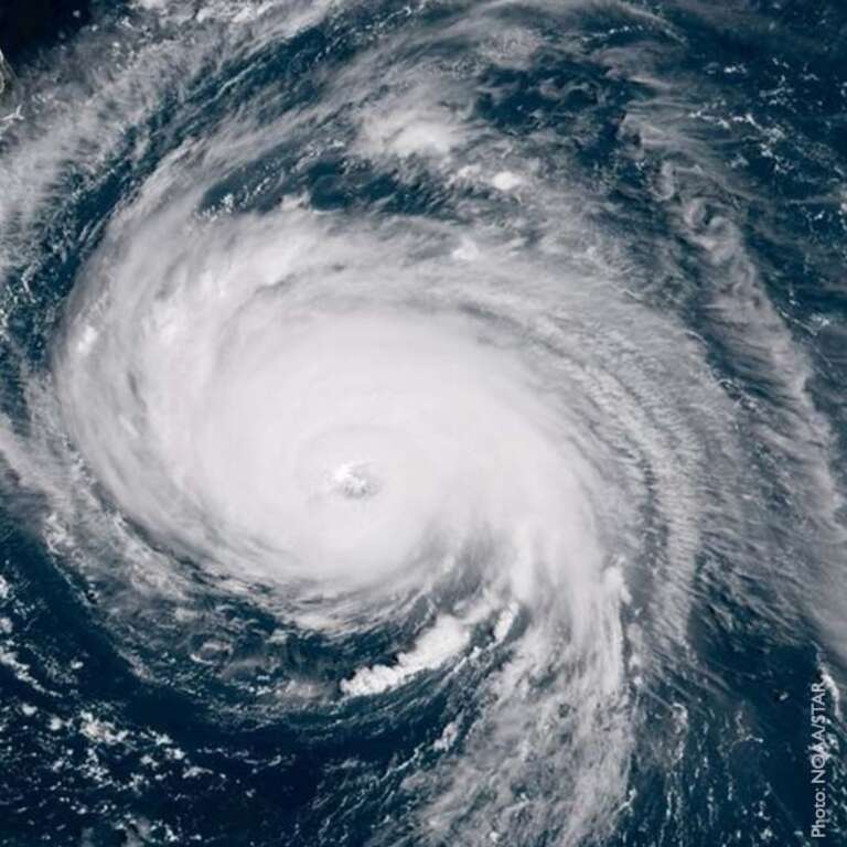 A hurricane forms over the ocean.