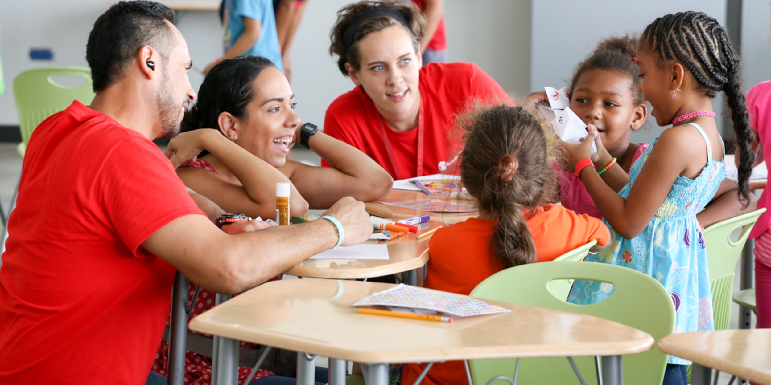 Save the Children staff members interact with children at a child-friendly space in Canovanas, Puerto Rico. Playing helps them recover from the trauma they experienced from Hurricane Maria. Photo credit: Save the Children, September 2017.  
