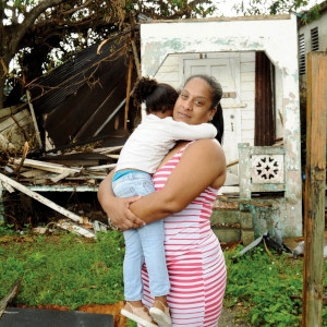 A mother hugs her daughter tightly as they cope with the aftermath of Hurricane Maria. Photo credit: Rebecca Zilenziger/Save the Children, September 2017.