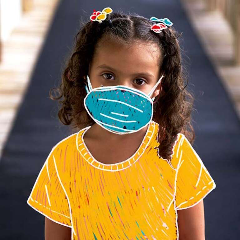 A young girl wears a facemask that has been hand-drawn on her photo. 
