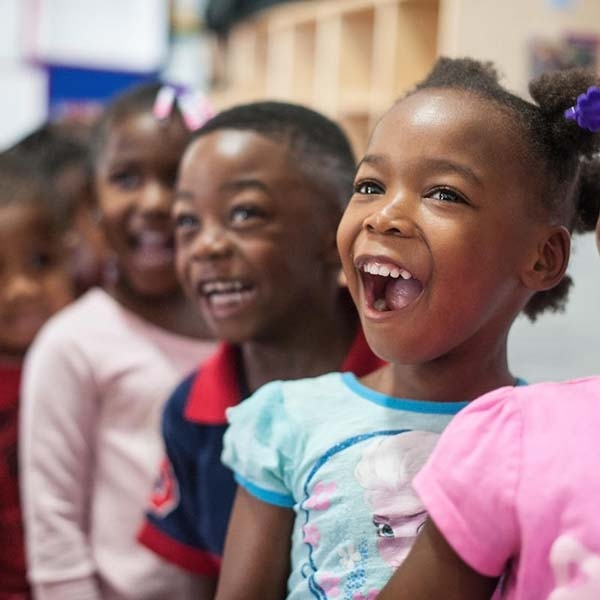 Children smiling in the classroom