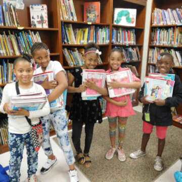 Children in US Programs receive books donated by American Girl.  Save the Children, March 2018