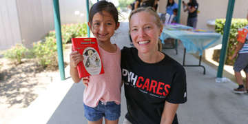 PVH associate Lisa with a child in our SummerBoost program at Washington-Reedley Elementary School in Central West Valley, California. Photo credit: Save the Children, July, 2017.